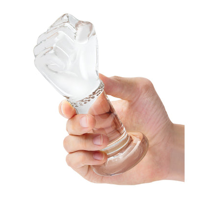 A hand holds the Gläs 5 Fist Butt Plug, a transparent glass piece perfect for temperature play. This body-safe glass features clear, frosted, and glossy accents, with its intricate design highlighted against a plain white background.