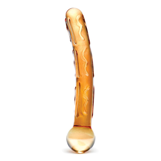 The Glas Tickler Dildo by Glas is a curved, translucent amber glass object featuring raised swirl designs and a ribbed texture. Its ergonomic shape includes a rounded base and tapered end, allowing it to stand upright against a plain white background.
