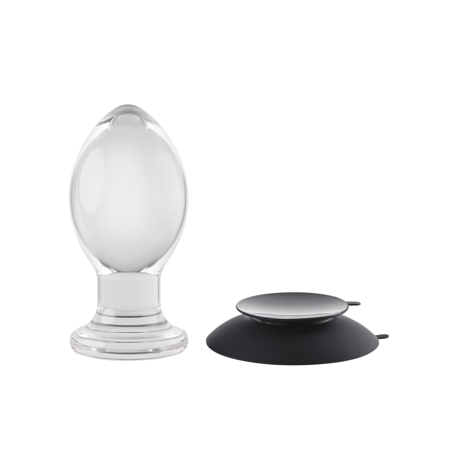 The Gender X Crystal Ball Plug with Suction Cup features a transparent, teardrop-shaped glass design and a round black silicone suction cup with minimalistic aesthetics, all displayed on a plain white background.