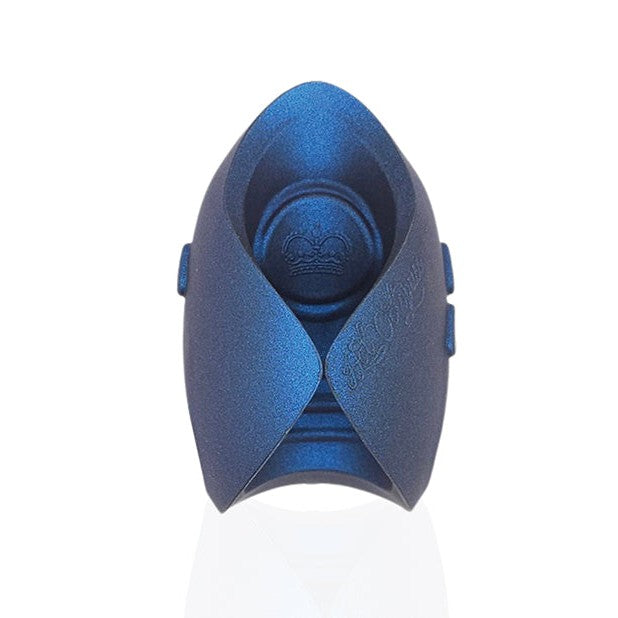 The blue, angular object with intricate lines resembles the Hot Octopuss Pulse Dragon Eye 10th Anniversary Limited Edition. Its smooth, matte finish and symmetrical design evoke a futuristic art sculpture. Standing upright on a reflective surface, it exudes an air of hands-free magic.