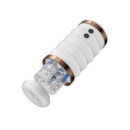 The Honey Play Box Warrior Auto Thrusting Male Masturbator is a sleek white and gold cylinder with a transparent middle section revealing its mechanism, featuring two black side buttons for seamless operation against a plain white background.
