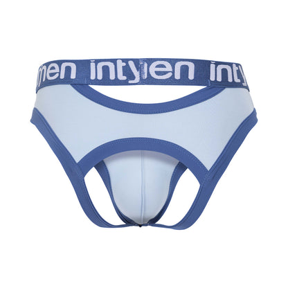 The Intymen Desert Jockstrap Crotchless Underwear features premium light blue fabric with darker blue trim and waistband, displaying the intymen brand in white. It includes cut-out sections and a supportive pouch for a secure fit.