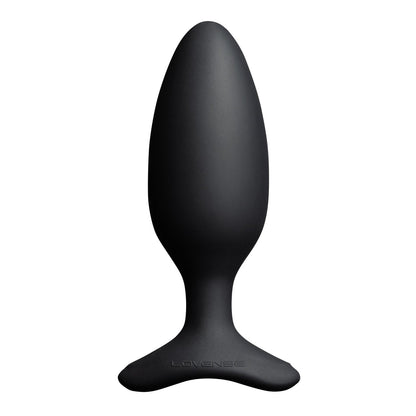 The Lovense Hush 2 Butt Plug is a sleek, black, oval-shaped vibrating toy with a wide, flat base. Crafted from 100% silicone, it has a smooth and solid appearance. The brand Lovense is elegantly engraved on the base, making it your silent partner in pleasure.