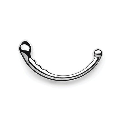 The Le Wand Stainless Steel Swerve is a shiny silver object with a smooth, rounded end on one side and a small spherical tip on the other. Its reflective surface features grooves along its curved body, ideal for prostate play adventures.