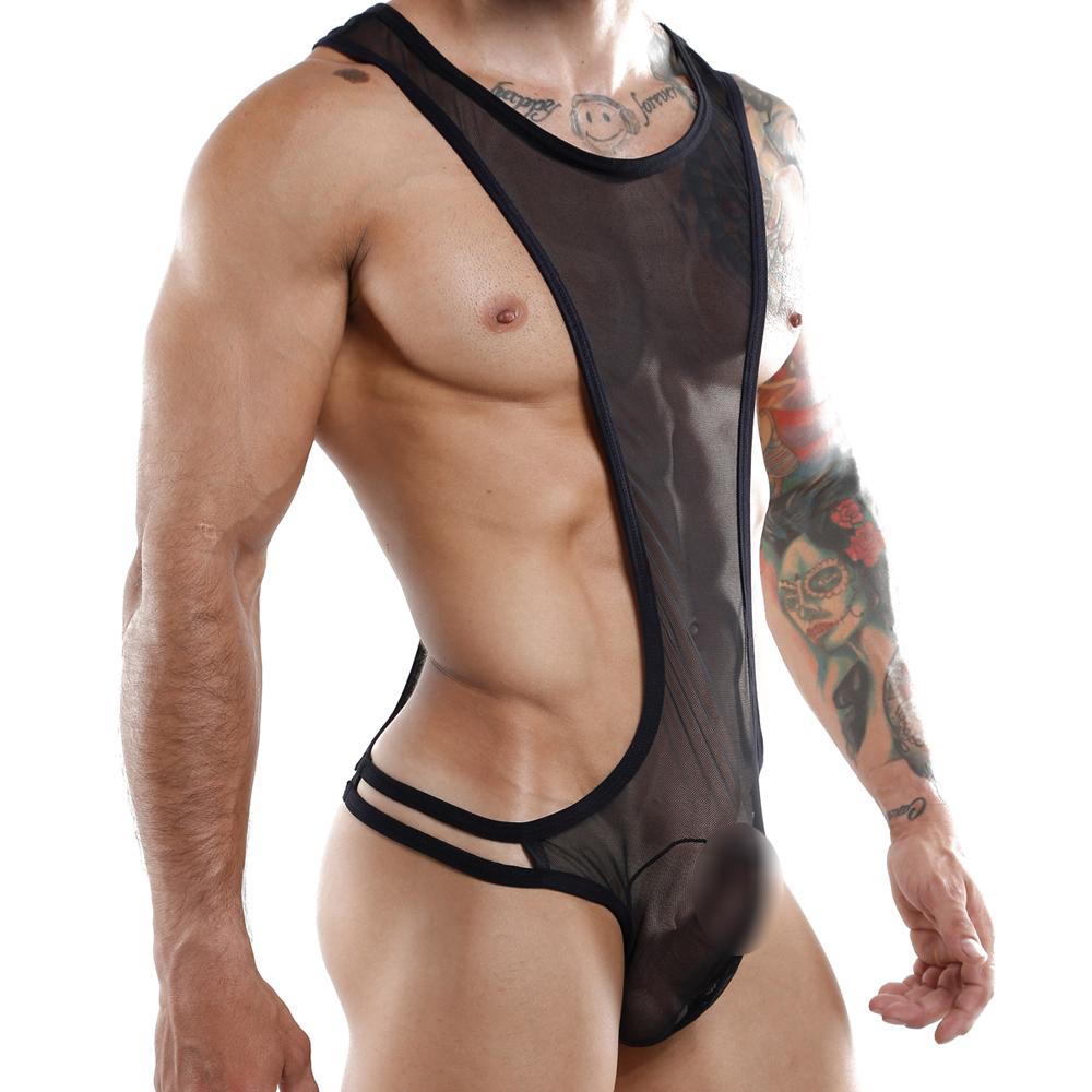 A person wearing the Miami Jock Body Suit, a sexy black sheer one-piece by Miami Jock, with tattoos on their arms. Crafted from luxurious fabric, it features thin straps and minimal coverage, highlighting a playful style against the plain white background.