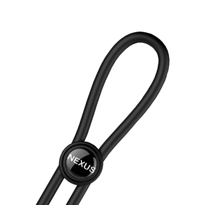 The Nexus Forge Double Lasso is a black, adjustable silicone cock ring featuring a flexible loop with a round clasp labeled Nexus. Made from smooth, elastic material, it resembles a cable tie or strap designed to enhance stamina.