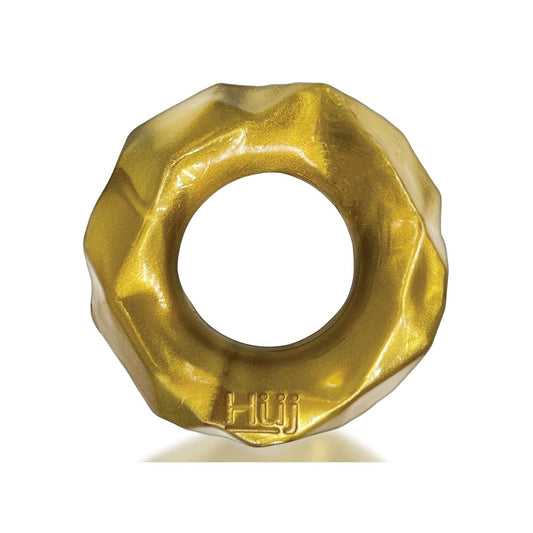 A golden, metallic donut-shaped ring with a wavy edge and central hole, made of Plus+SILICONE and embossed with Hüj, reflecting Hunky Junks design style. This is the Hunky Junk Fractal Cockring by Hunky Junk.