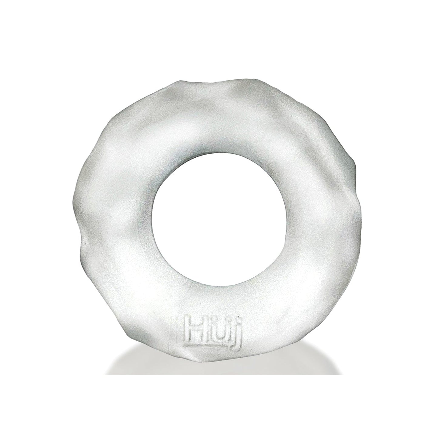 The Hunky Junk Fractal Cockring is a white, round doughnut-shaped object with a textured edge made from Plus+SILICONE. It has Hüj embossed on the smooth surface and an open circular design.