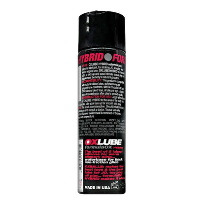 A sleek black can labeled Hybrid Formula displays white and pink text with product details. The bottom section highlights Oxylube, showcasing Ox Balls OXLube Formula by Oxballs for ultimate slickness. Proudly made in the USA is noted at the bottom.
