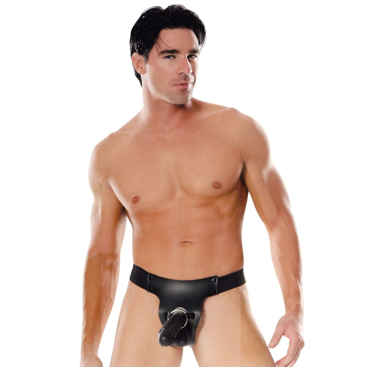 A man wears a black Fetish Fantasy Series Mr. Big Hollow 8 Strap-On against a plain white background, maintaining a neutral expression, with dark hair and a toned physique.