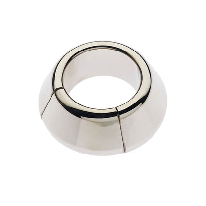 The Plesur Heavy Cone Magnetic Ball Stretcher by Plesur is a shiny, stainless steel ring with a wide base and narrow top. It has a smooth, polished surface with two vertical seams and resembles a conical collar. A magnetic closure ensures a secure fit.