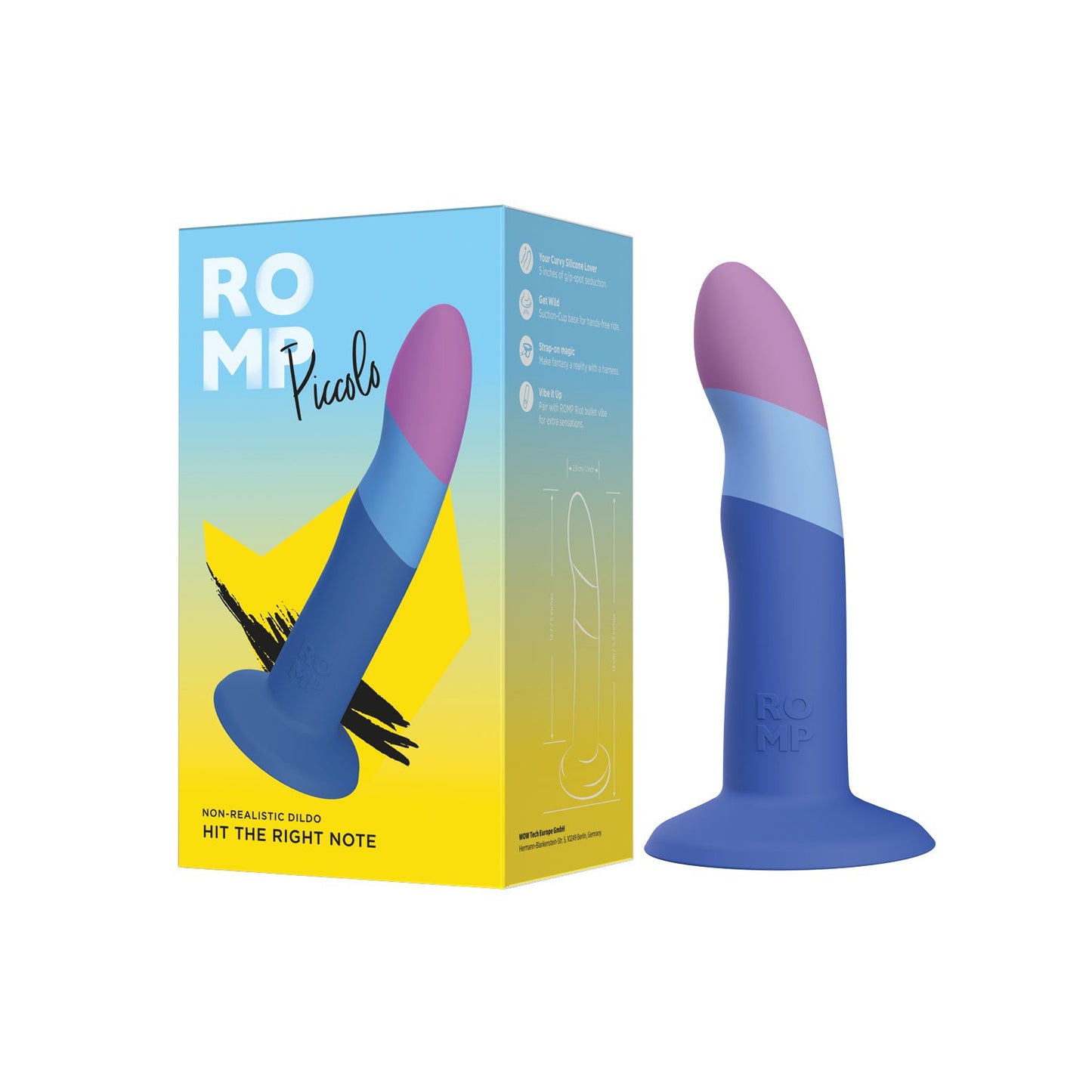 The ROMP Piccolo 3 Color Dildo, crafted from body-safe silicone, features a curved design in vibrant purple, pink, and blue. It stands upright next to its yellow and white box featuring the same design and labeled with the brand name ROMP.