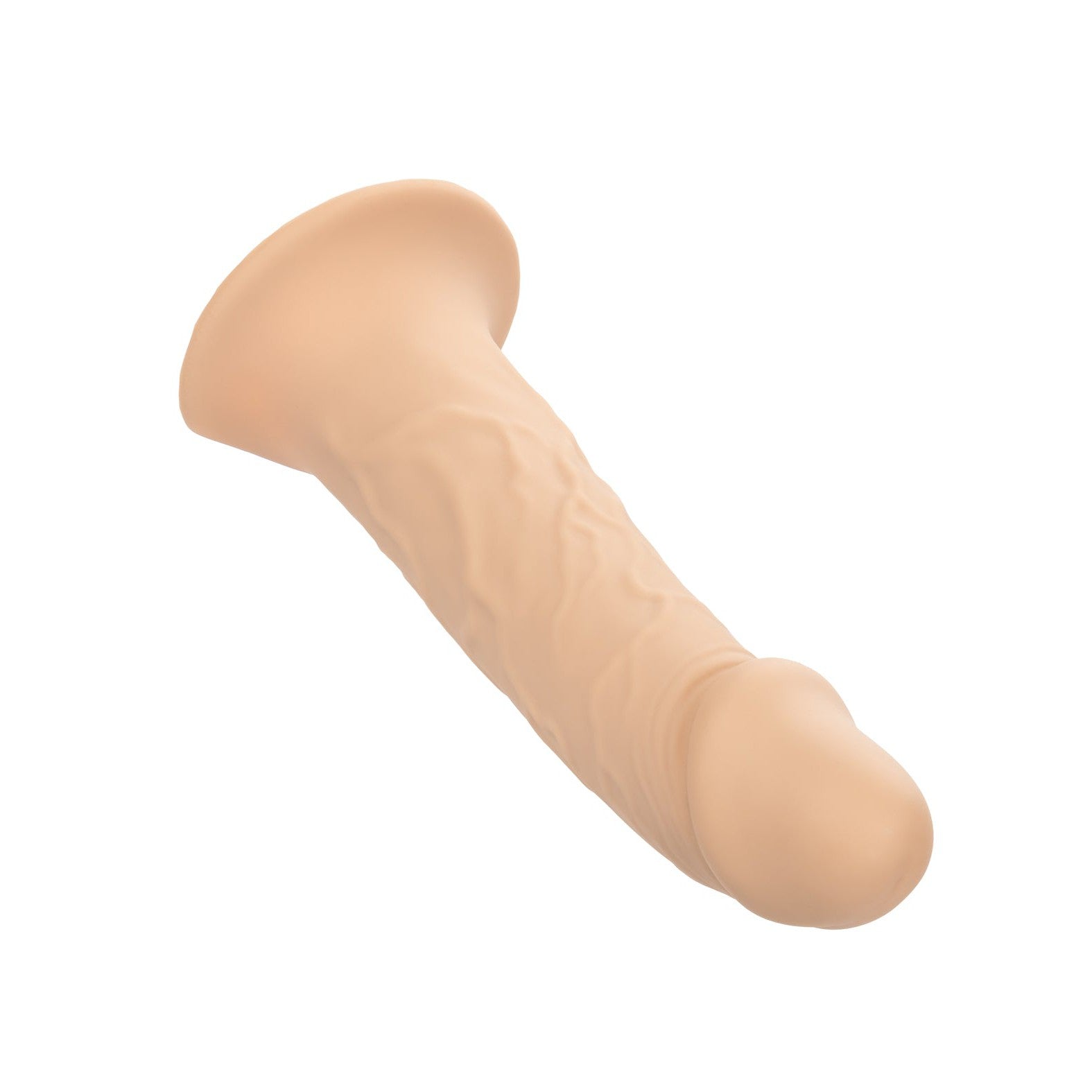The Performance Maxx Life-Like Penis Extension With Harness by California Exotic Novelties is a beige silicone dildo with a realistic design, featuring textured veins and a flared base, angled to the side on a white background.
