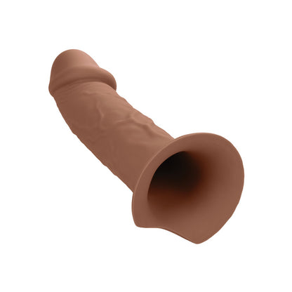 The Performance Maxx Life-Like Penis Extension With Harness by California Exotic Novelties is a silicone prosthetic with a semi-realistic shape. It has a curved design, textured surface, and flared base for comfort and security, making it perfect for your harness system.