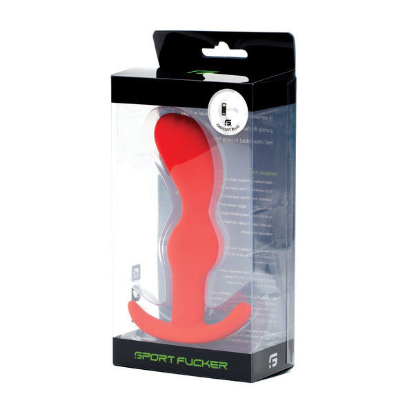 The Sport Fucker Crossfit Plug displays a chic red design of medical-grade silicone, encased in a transparent plastic box. Its packaging boasts elegant text and branding with a refined black top section, ensuring both style and reliability.