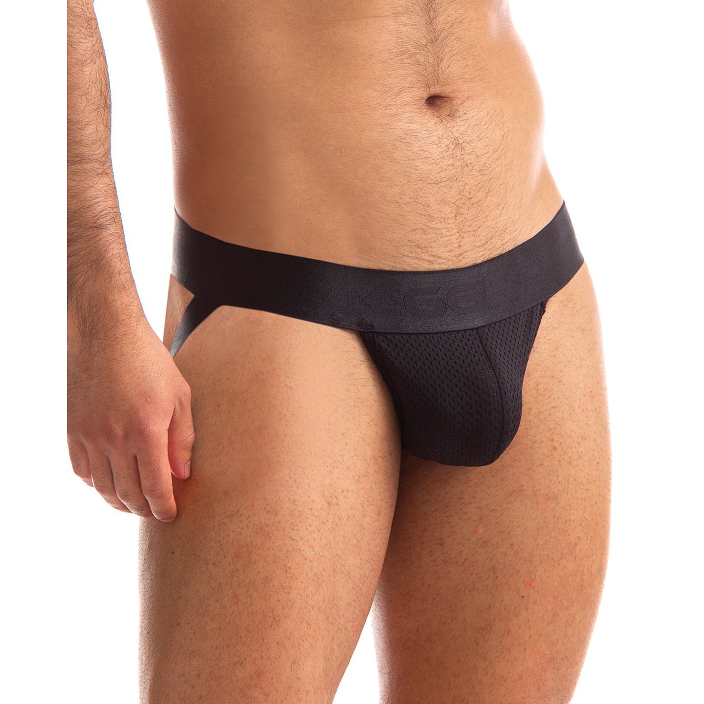 Modeling the 665 Stealth Jockstrap by 665 inc, featuring a black wide waistband and crafted from premium nylon for comfort and durability. The enticing see-through mesh pouch is showcased against a white background, with only the lower torso and upper thighs visible.