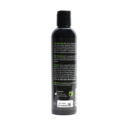 A black 8 oz bottle of Sport Fucker Silicone Lubricant features green and white text with usage instructions and ingredients. The premium lubricants long-lasting formula is ensured by expiry and lot numbers prominently displayed at the bottom.