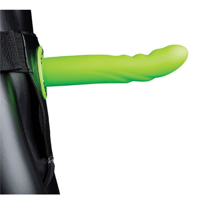 The Shots Ouch 8 Textured Curved Hollow Strap On - Glow in the Dark is an adjustable-fit black harness with a glow-in-the-dark texture on the front. Made from body-safe materials, it includes a comfy zipper and straps, and its elongated cylindrical shape stands out prominently.