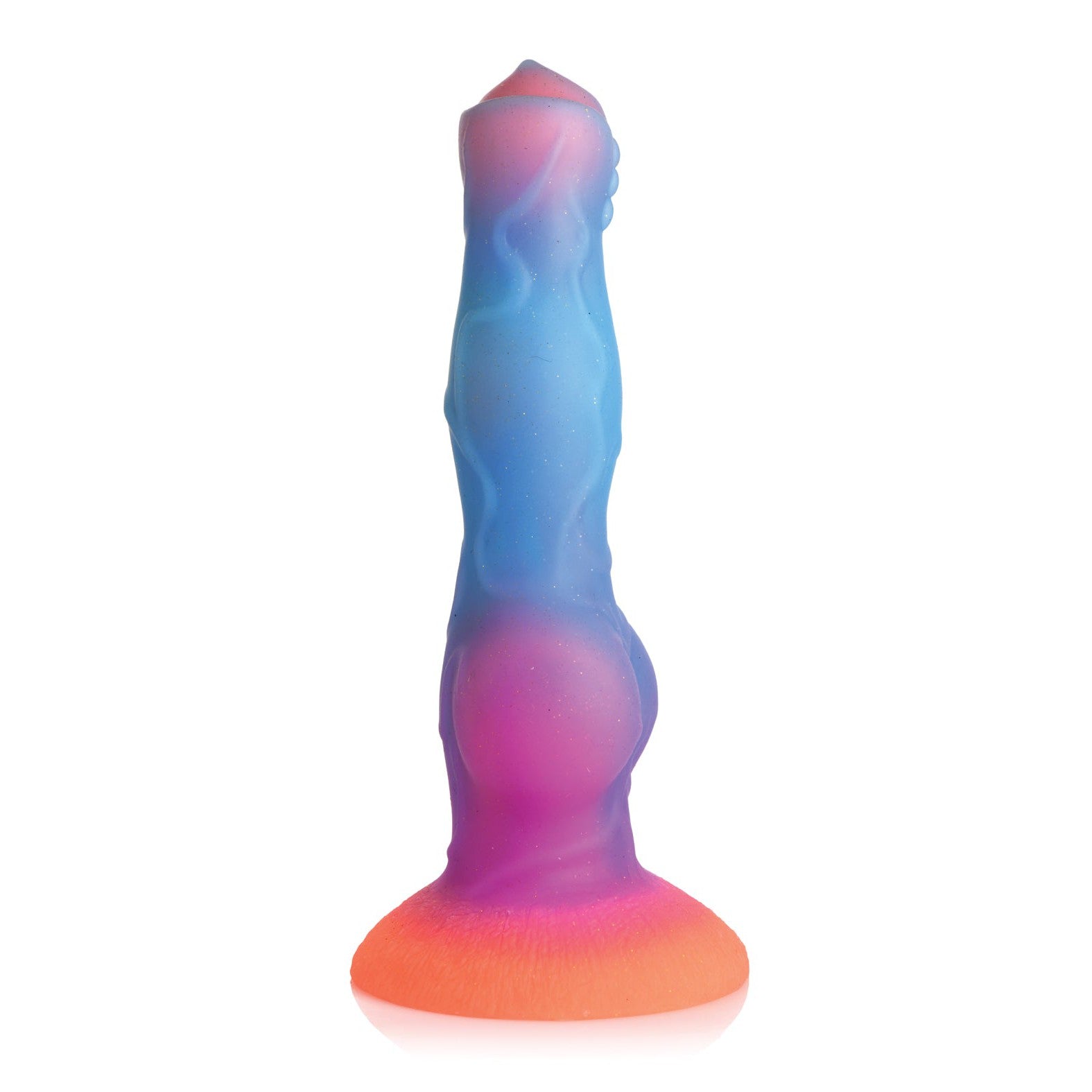 The Creature Cocks Space Cock Silicone Alien Dildo, with a gradient of blue, purple, and orange tones, features detailed texture and a flared base. It glows in the dark and stands upright against a white background to ignite fantasies.