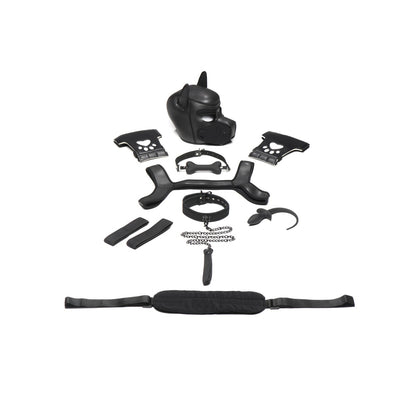 The Master Series Pup Arsenal Set by Master Series, featuring a neoprene pup hood, black dog mask, two cuffs, harness, collar, leash, and black handles, is elegantly displayed on a white background.