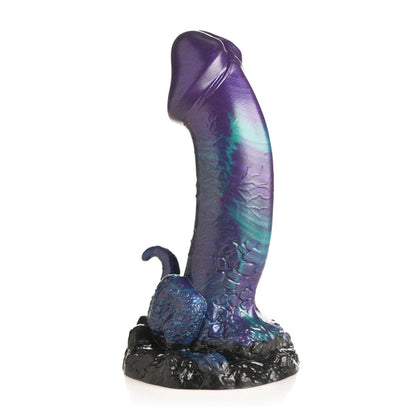 A textured, elongated purple and teal sculpture with a black base showcases a subtle dino theme, crafted as the Creature Cocks Dino Dick Silicone Dildo by Creature Cocks.