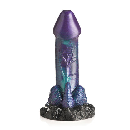 The Creature Cocks Dino Dick Silicone Dildo from Creature Cocks features a colorful, fantasy-themed, purple and blue iridescent design with a textured black base resembling rocky terrain, embodying a dinosaur-inspired toy aesthetic.