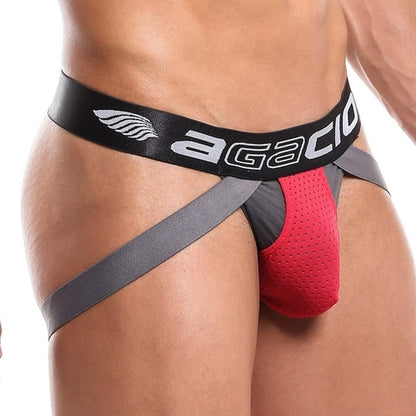 Featuring the exotic look of the Agacio Thriller Jockstrap, this piece offers a striking red and gray design with a black waistband displaying the Agacio brand. Crafted from premium fabric, it has small perforations that enhance texture and comfort.