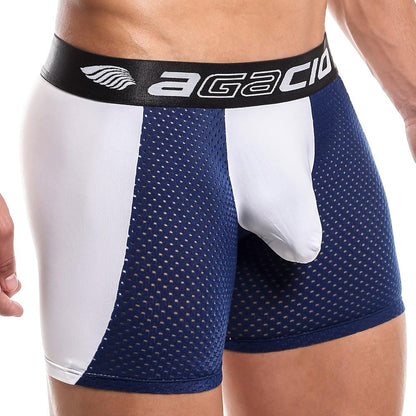 Someone is wearing Agacio Beat It Boxer, showcasing a black logo waistband. The fabric combines a see-through dot pattern with solid white side panels, and the contour pouch magic provides enhanced support.