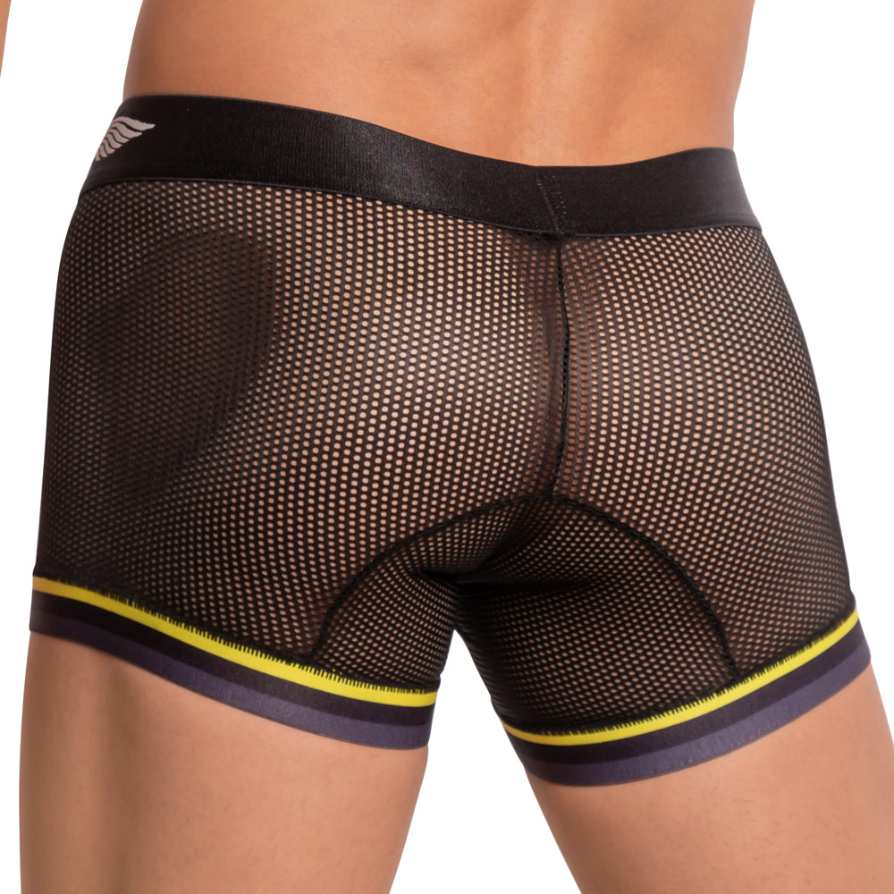 A person is seen from the back wearing Agacio Atlantis Boxer Trunk in black mesh with yellow and black trim, highlighting its textured design. The semi-transparent material ensures a snug, comfortable fit.