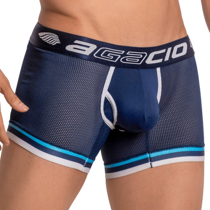 A person wears the Agacio Atlantis Boxer Trunk, featuring blue mesh with a navy waistband and white Agacio print. The design includes light blue and white stripes by the leg openings, focusing on the lower torso and thighs.
