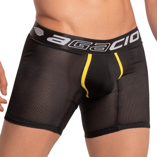 Someone is wearing Agacio Scuba Boxer Trunks, featuring a thick waistband with a white logo and black lettering. These breathable black mesh briefs have a stylish yellow accent at the front. The background is plain white.
