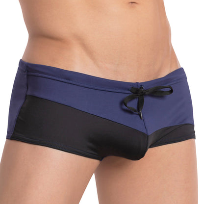 Close-up of a person wearing the Agacio Ocean Swim Trunk by Agacio, featuring a stylish navy blue and black two-tone design with an adjustable drawstring waist for comfort.