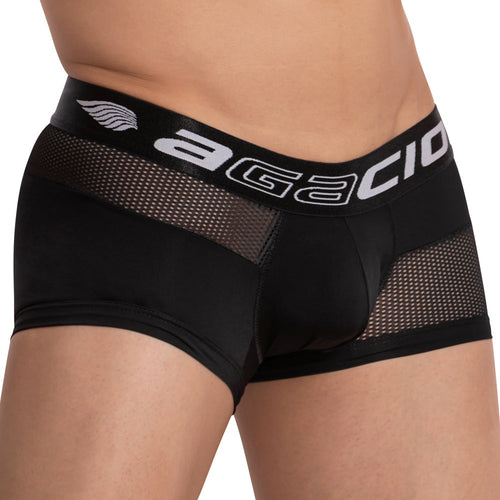 Close-up of a person wearing Agacio Guy Boxer underwear showing a wide waistband with Agacio in white letters. The stylish and breathable fabric combines solid and mesh patterns, emphasizing the style and design.