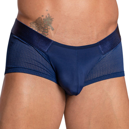 A person wears the Agacio Sheer Sides Boxer Trunk, a mens underwear in dark blue with sheer mesh panels and a wide elastic waistband, highlighting a tattoo near the waist. It features a supportive pouch for comfort.