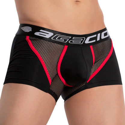 A person wearing Agacio Strapped Piping Boxer Trunk, featuring black mesh with red trim and a branded waistband, offering both breathability and sensual comfort.