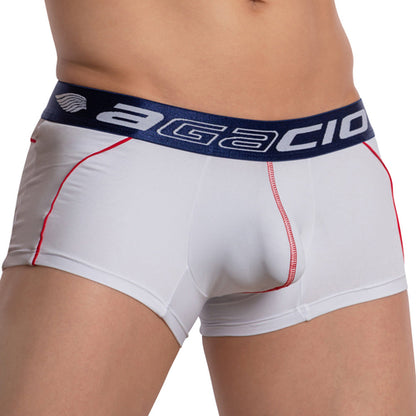 Someone in Agacios Centerseam Bulge Boxer Trunk, white and navy with red stitching, enjoys breathable comfort thanks to its branded elastic waistband.