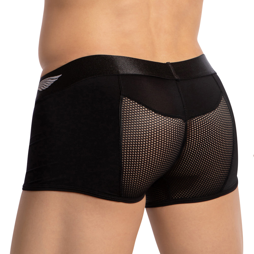A person is shown from the waist down wearing Agacio Breathable Back Boxer Trunks. These black shorts, by Agacio, feature solid fabric with mesh panels and a wing design waistband for a comfortable, supportive fit. The background is plain white.