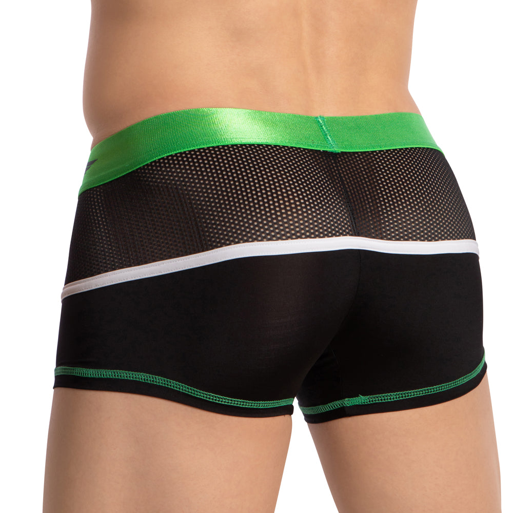 A person is shown from the back wearing Agacio’s Multi Color Piping Boxer Trunk in black mesh with premium fabric, vibrant multi-color piping, a green and white waistband, semi-transparent style, and green trim.
