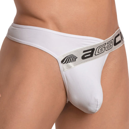 Someone wearing a white Agacio Deep Sea Thong features a thick waistband with AGA and a leaf design. Made from Light as Air Fabric, it fits snugly around the hips, providing Functional Pouch Support for comfort and style in every wear.