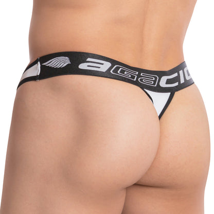 A person wearing Agacio The Reverse Thong, a black and white mens design with a branded waistband, highlights the lower back and buttocks with its sexy triangular cut and sleek fit.