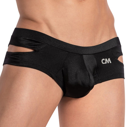 A close-up showcases a person wearing the Cover Male Shiny Pouch Jockstrap, featuring a sleek side cut design with CM initials on the waistband. The smooth, shiny fabric emphasizes its unique style, though the persons torso is partially out of view.