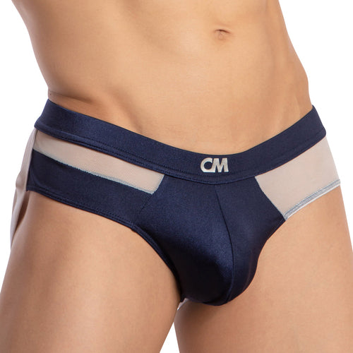 A person wearing the Cover Male Backless Beauty Jockstrap in dark blue features sheer mesh panels, a logo waistband, and a cheeky design.