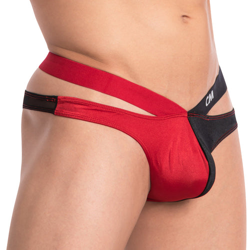 A close-up captures a person in Cover Males The Split Bikini, emphasizing its bold strap design. The side view highlights the distinctive two-tone style, with contrasting red and black colors that make this Cover Male piece stand out.