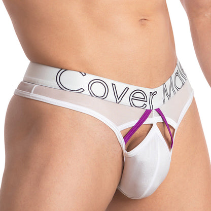 A person wearing the Cover Male Doral Bikini, featuring a white and purple design with sexy color contrast. It has a stretchable sheer waistband with black lettering, and its pouch features cut-out sections for a modern, minimalist look.