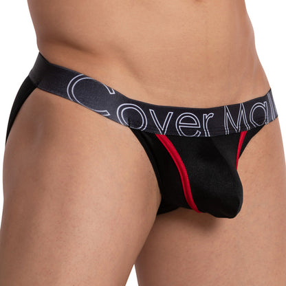 A person models the Cover Male Color Me Bikini by Cover Male, featuring mens briefs with black and red piping and a thick waistband with text. The lightweight fabric adds comfort and style, set against a plain white background.