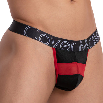 A person is wearing a black and red Cover Male Focus Thong, made of sheer and solid fabric, with the brand Cover Male visible on the waistband.