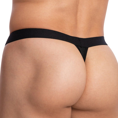 Close-up of a person wearing the Cover Male Bi-Color Sexy Thong, highlighting its body-enhancing fit. The image focuses on the lower back and hips, showcasing the brands design.