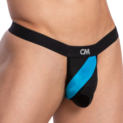 A person flaunts the Cover Male Bi-Color Sexy Thong, showcasing a body-enhancing fit. The black and blue design with CM on the waistband highlights its supportive pouch, focusing on the lower torso.