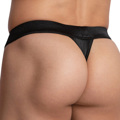 The image displays a person wearing the Cover Male Love Me Thong, highlighting the ideal V-shape lift of their lower back and buttocks. Made from breathable fabric, this thong suits light to medium skin tones against a plain white backdrop.