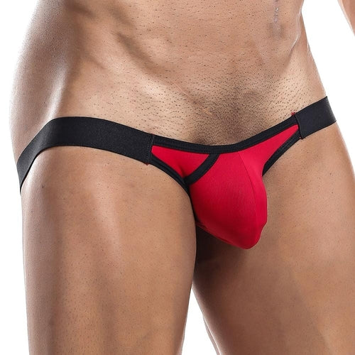 A person is wearing the Playmaker Jockstrap by Intymen, featuring red and black colors with mesh fabric, showcasing the fit and design. The focus is on the midsection, highlighting style and color contrast.